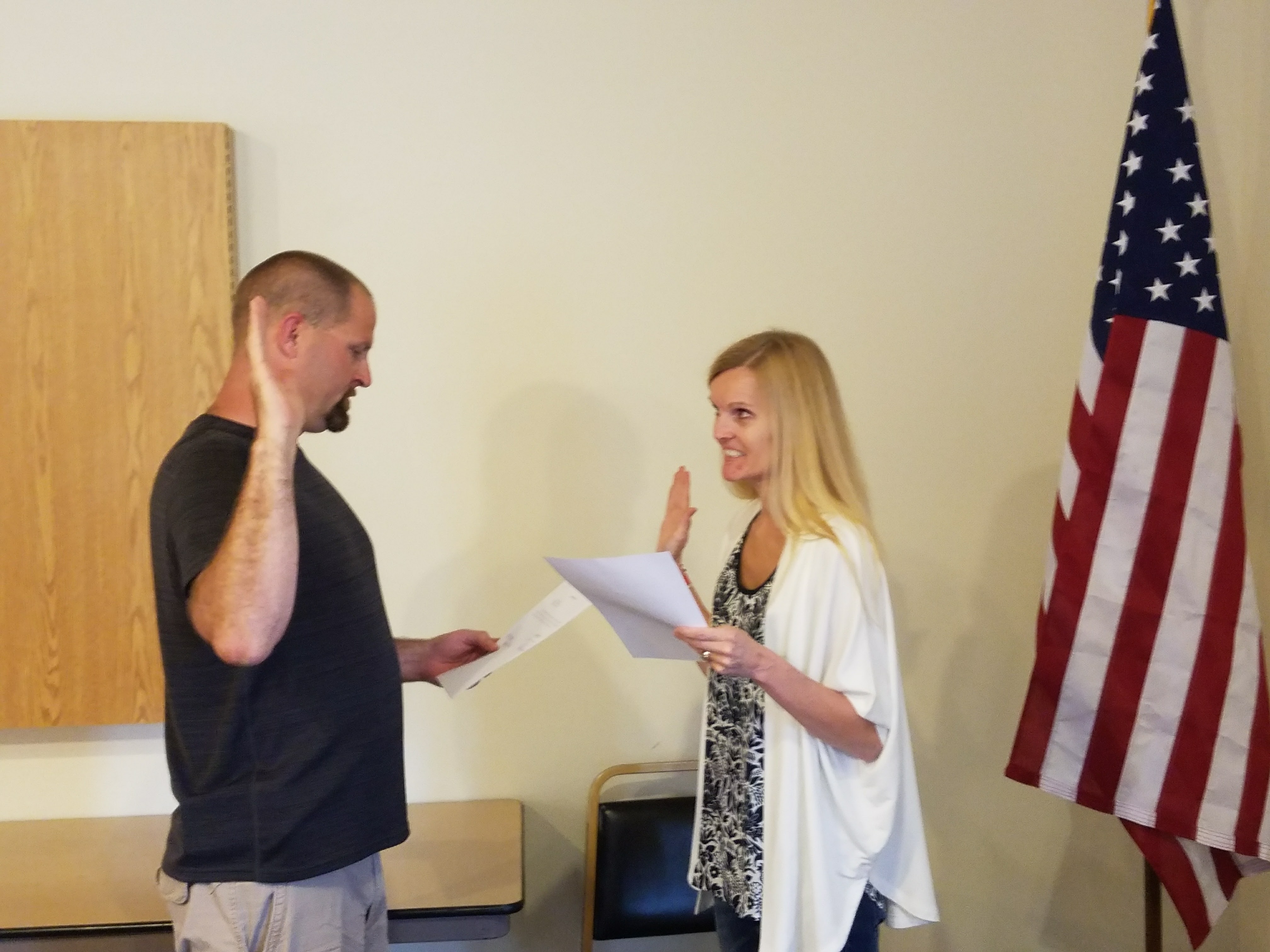 Jake Adamson being sworn in by Heather Greenquist